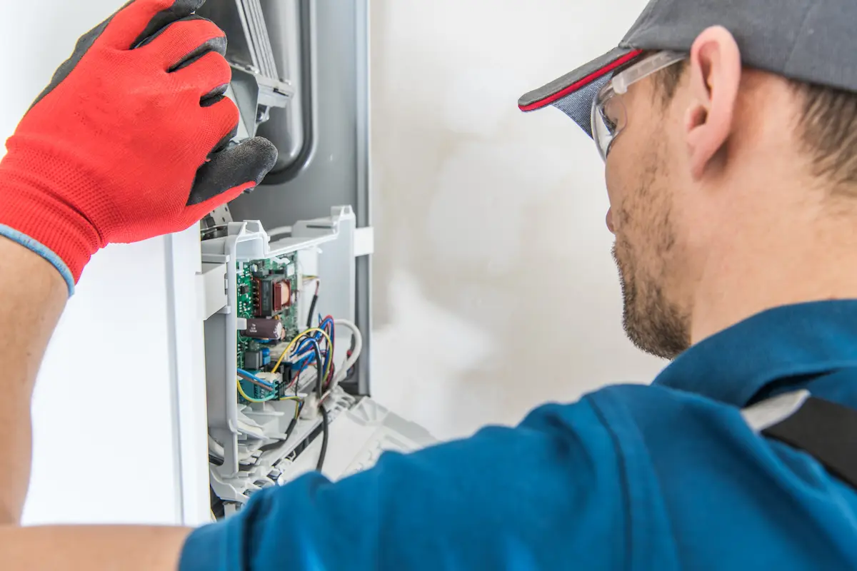 Commercial HVAC furnace equipment being serviced