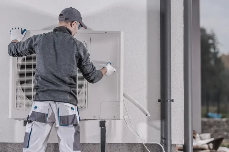 Techinician replacing a heat pump