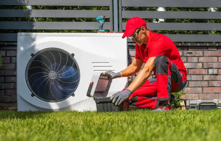 Technician installing a heat pump unit